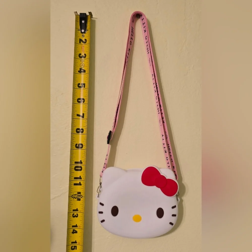 NWT Sanrio Hello Kitty Face Adjustable Crossbody Bag with Pink Strap and Red Bow